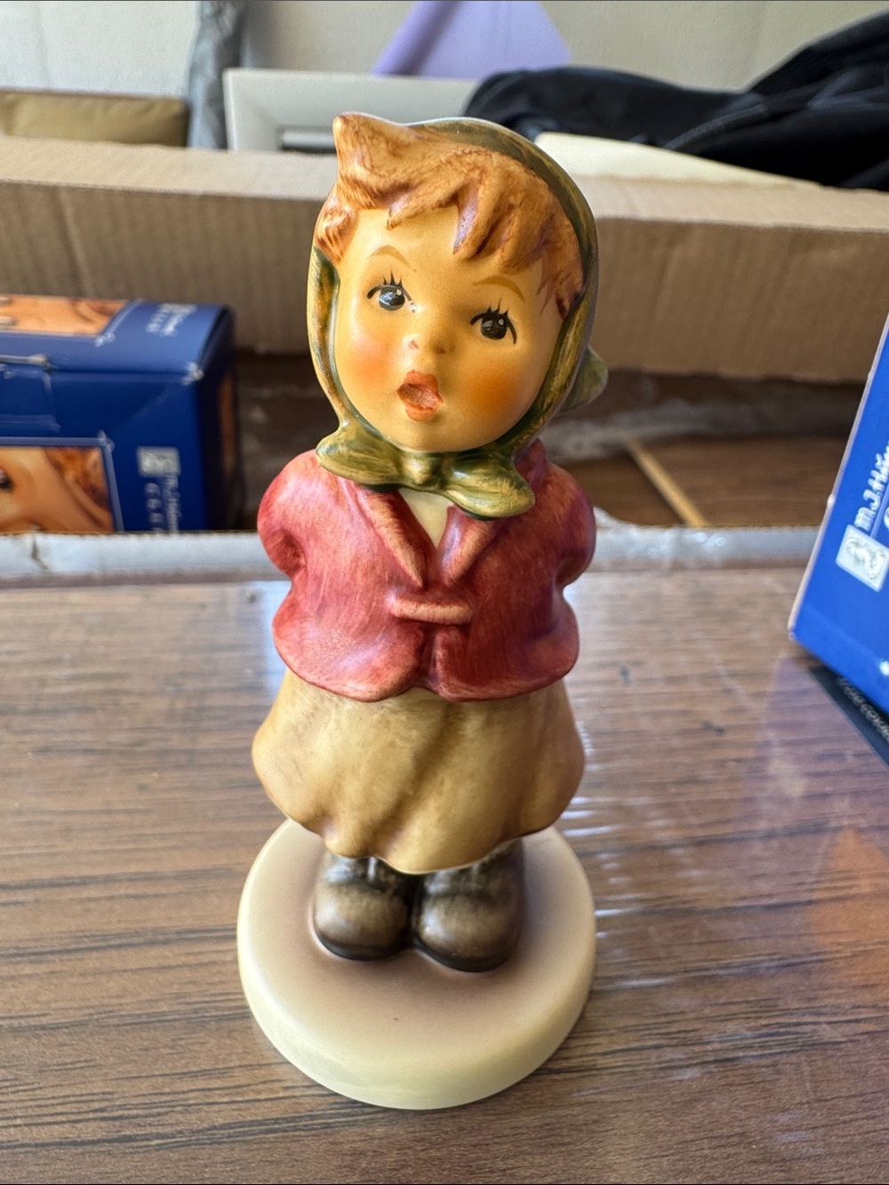 Vintage Hummel-Style Girl Figurine in Red Jacket and Tan Skirt